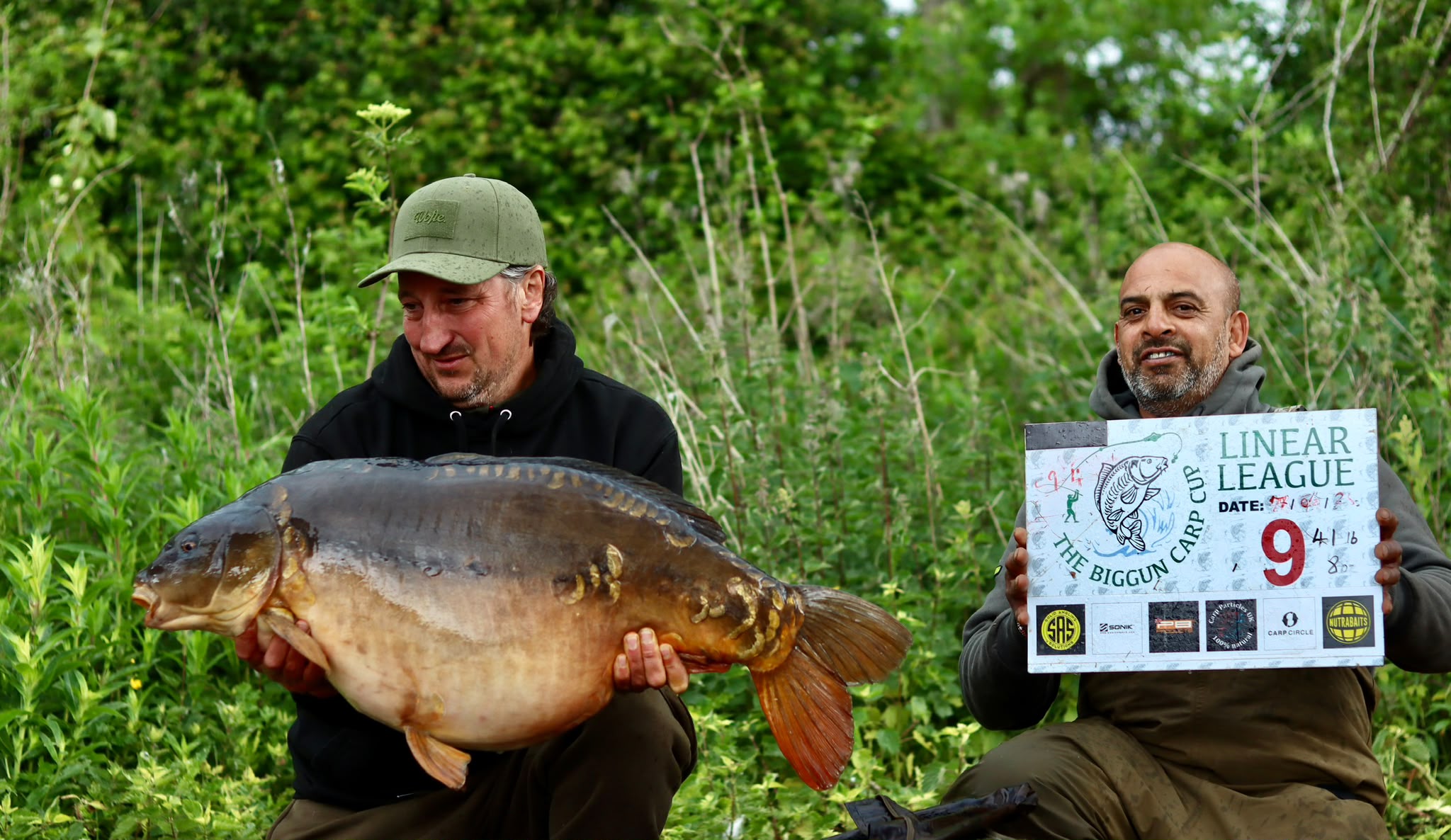 Linear mirror carp of 41lb 8oz held up at Linear League