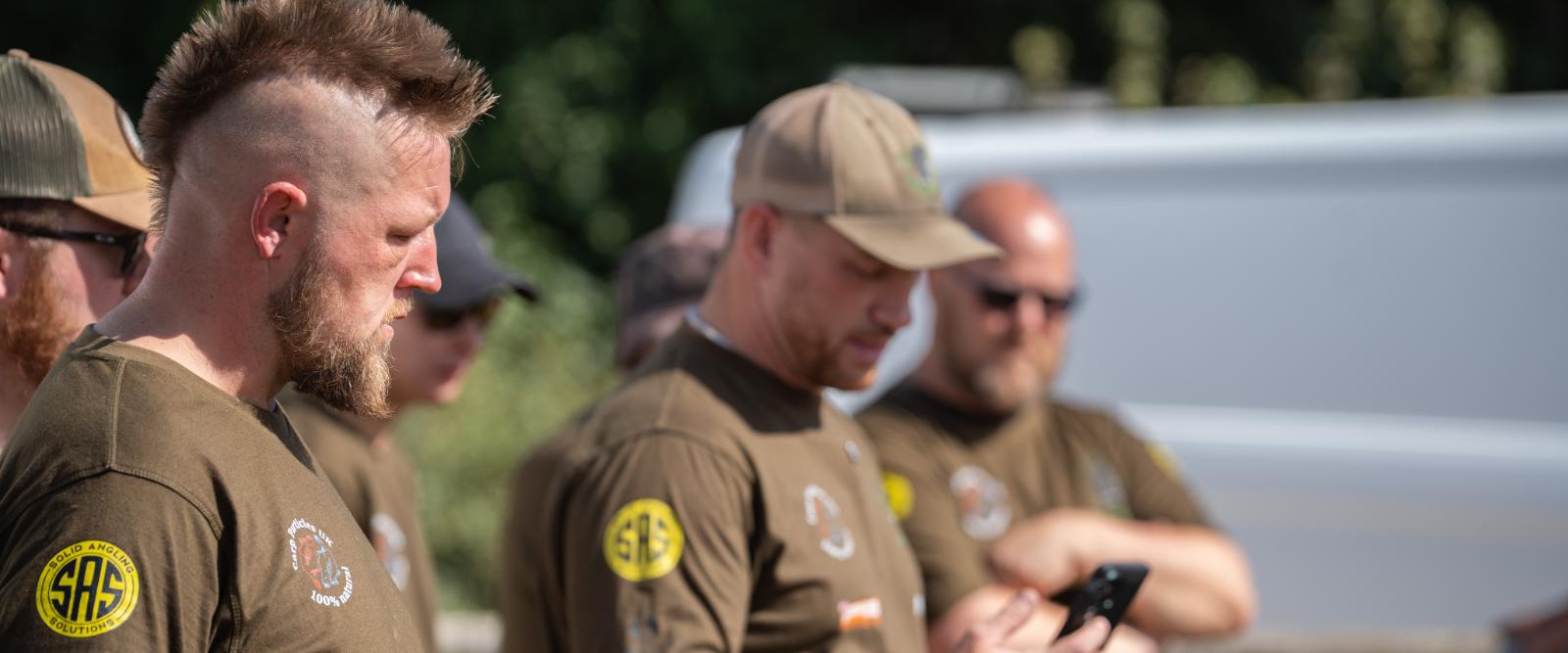 Linear League anglers in The Biggun Carp Cup shirts at the match HQ
