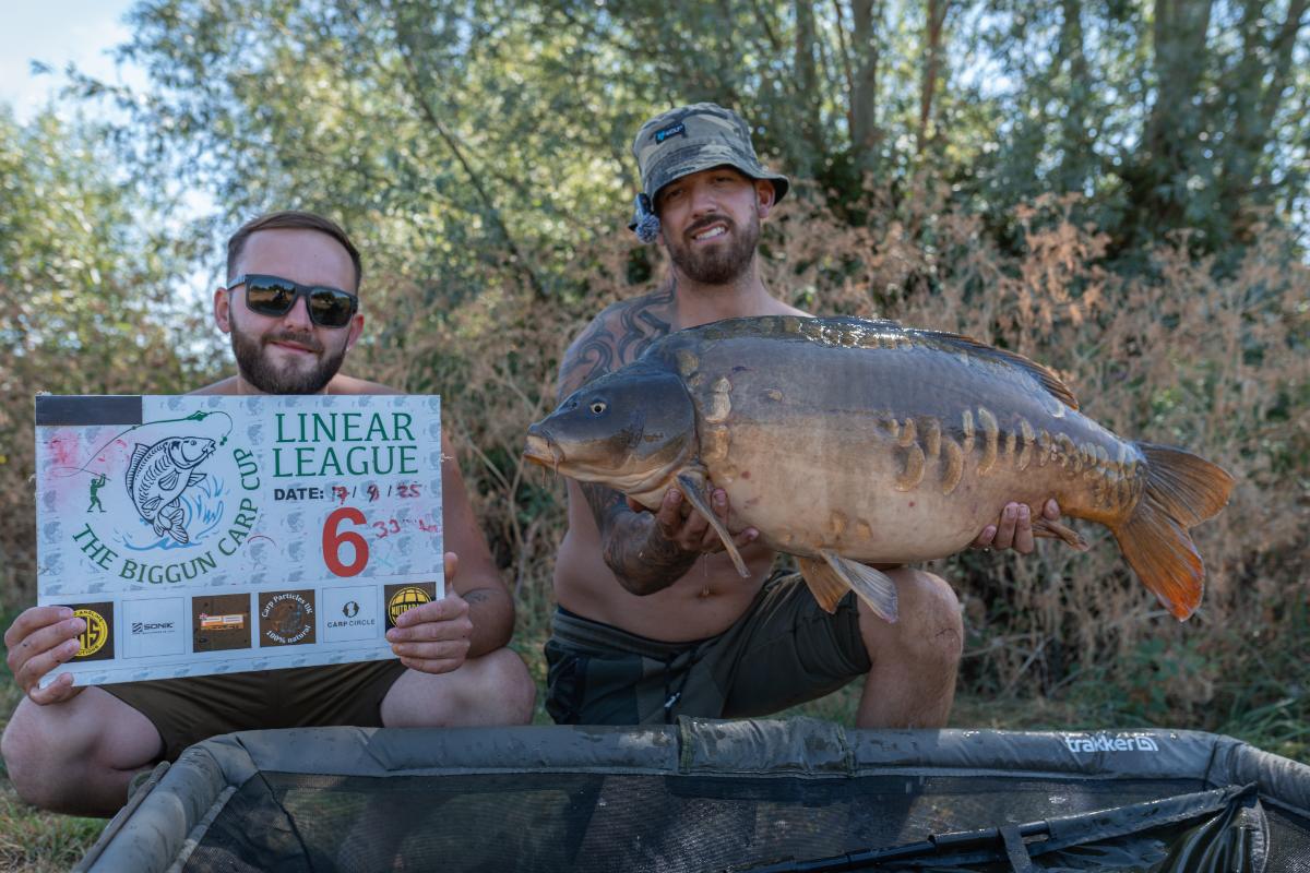 Linear League pair with a big mirror carp and the Round 6 peg board